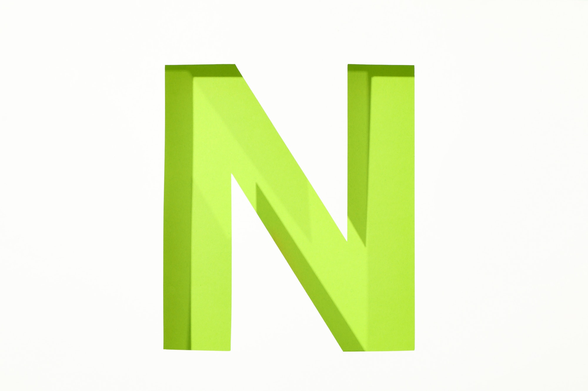 Color letter N on white background, space for text